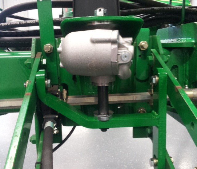A closeup of the hydraulic down force machine.